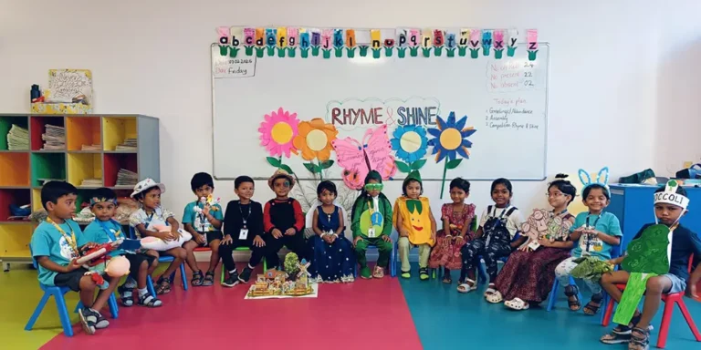 Happy kindergarten children with backpacks at school